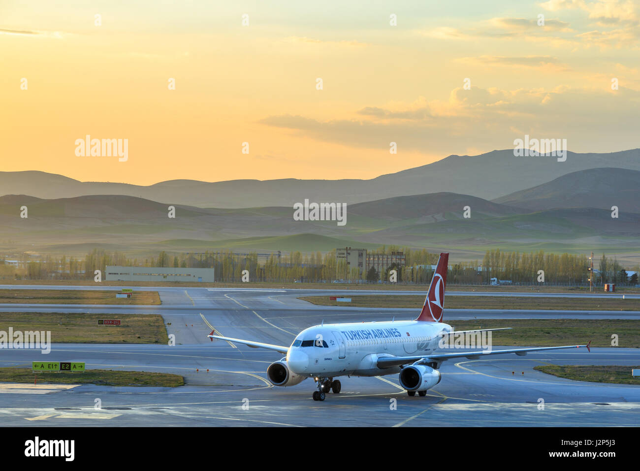 At Esenboga airport in Ankara, Turkey - April 29, 2017 : Turkish airlines plane inside the Esenboga airport during sunset Stock Photo