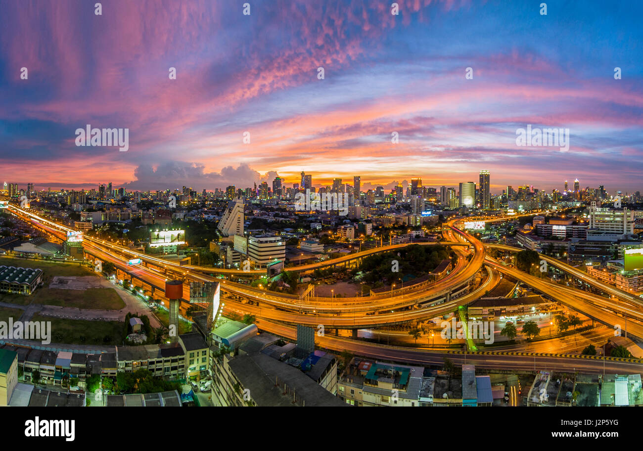 The traffic jam on expressways of Bangkok city with colorful sky twilight, tilt-shift blur effect Stock Photo