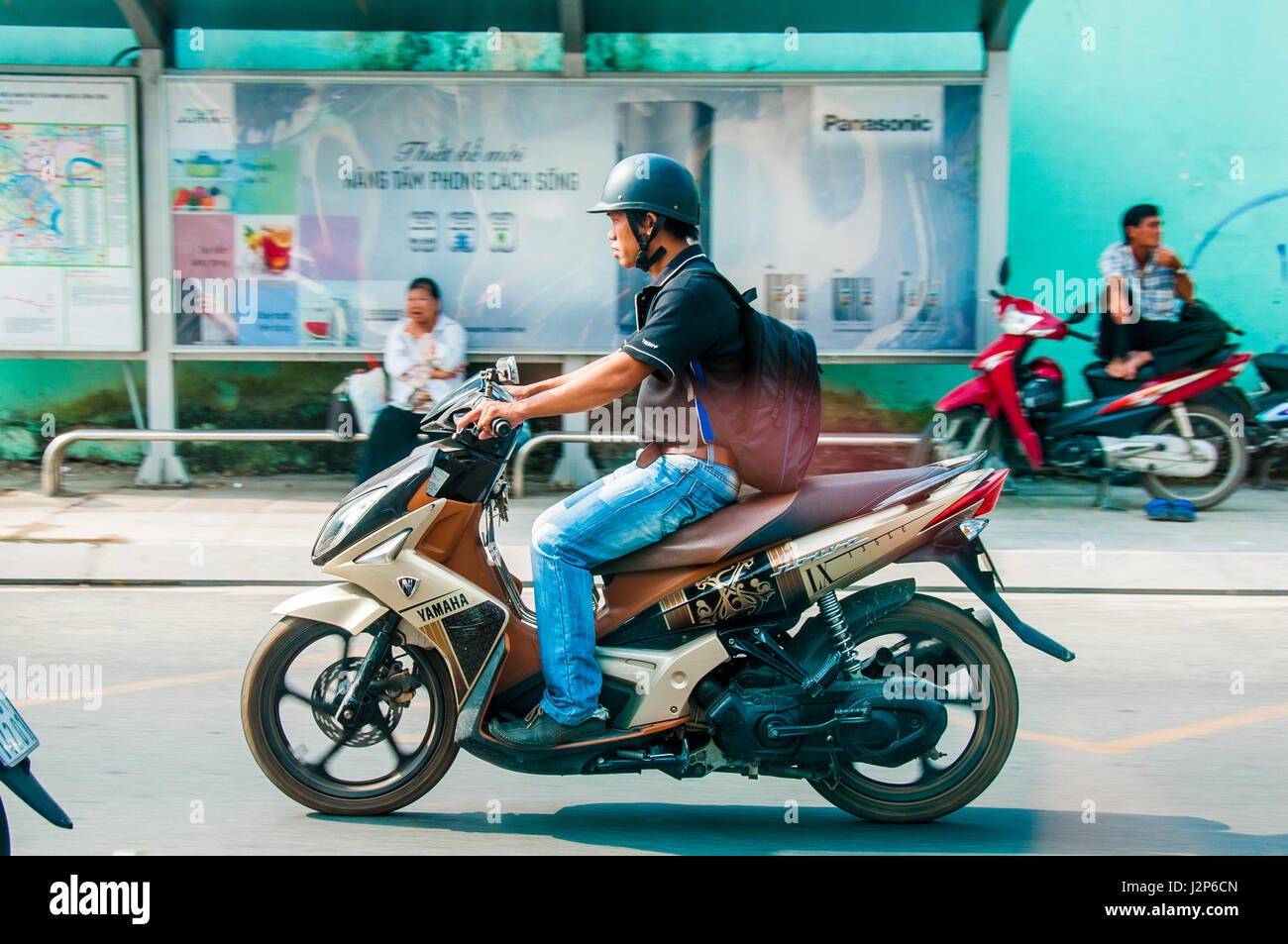 Ho Chi Minh city, VIETNAM - MARCH 29, 2017: men driving a scooter outdoor in Ho Chi Minh city, Vietnam Stock Photo