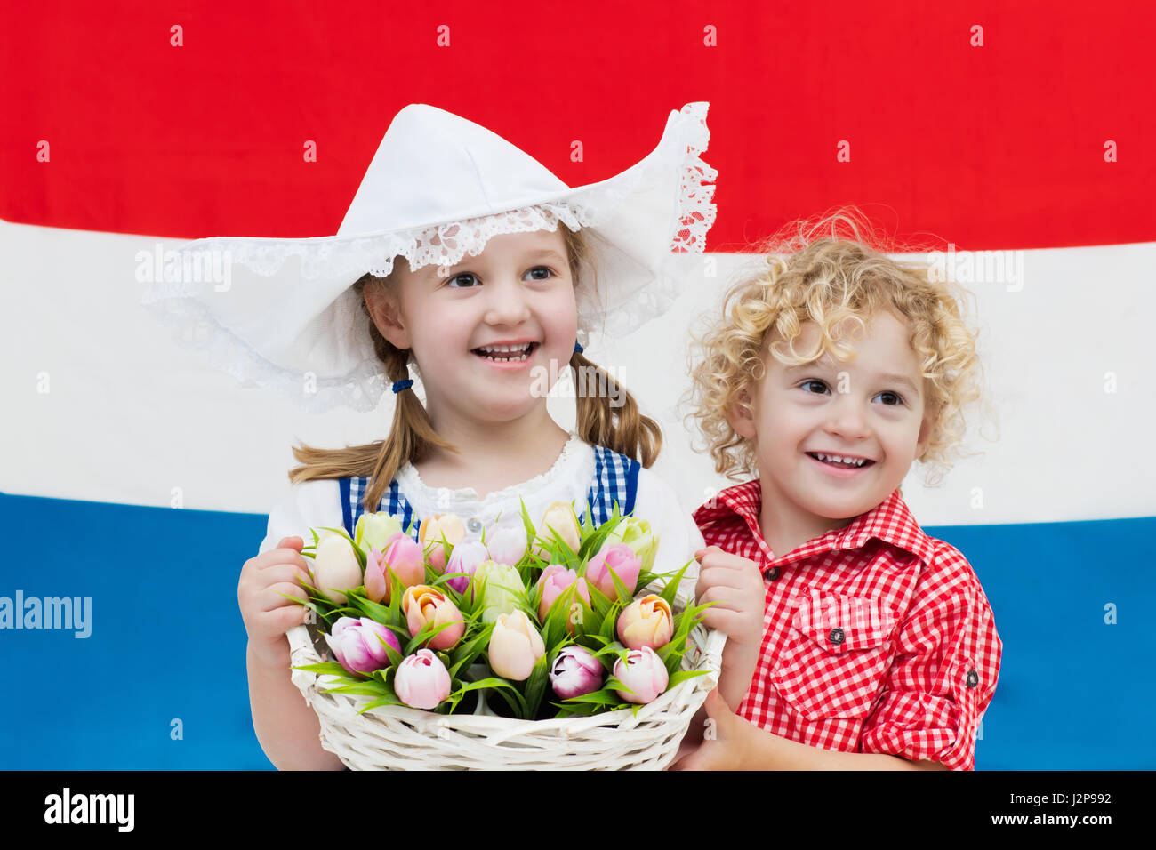 Dutch costume holding tulips hi-res stock photography and images - Alamy