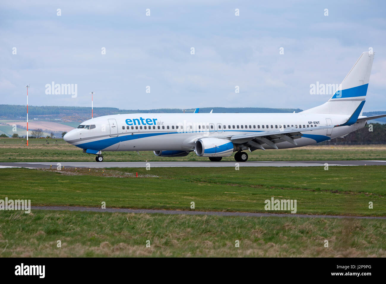 A Polish 737-8AS departing Inverness Dalcross airport in the Scottish Highlands, UK. Stock Photo