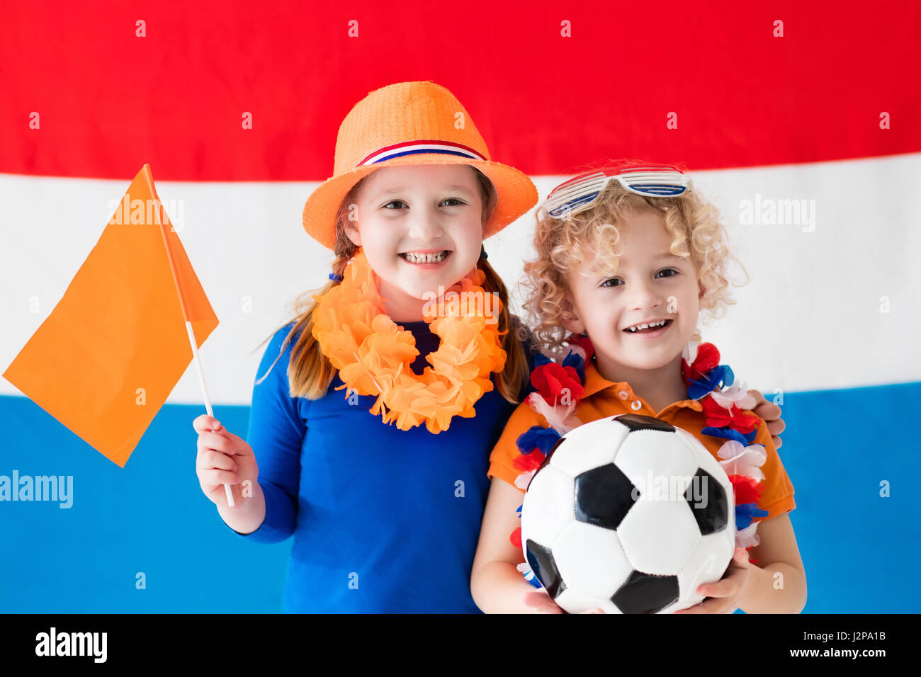 Children cheering and supporting Dutch football team. Kids fans and ...