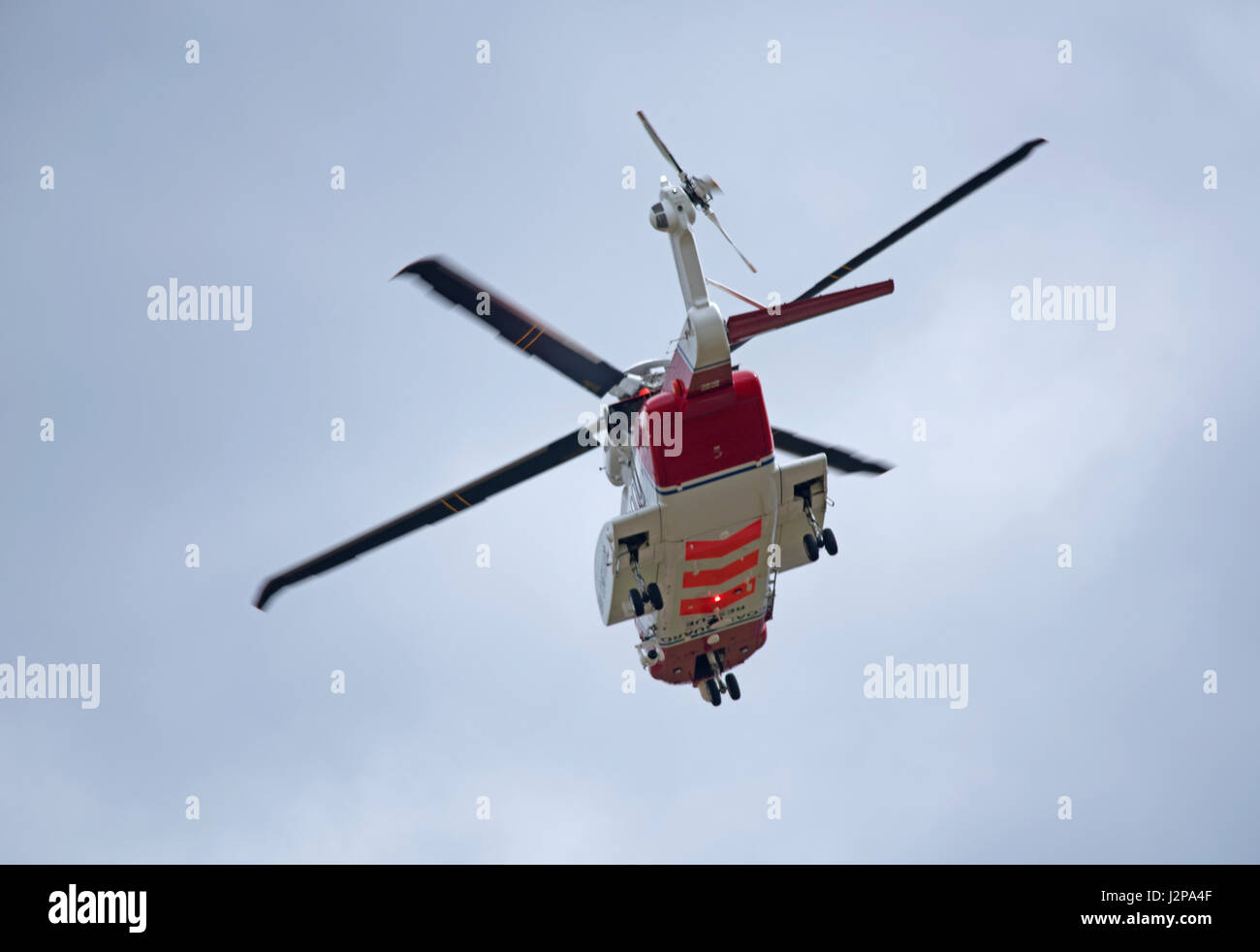 Coastguard helicopter departing from home base at Inverness Airport on call out. Stock Photo