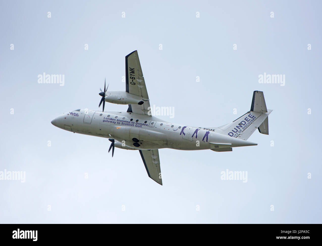 A Dornier 328-100 turboprop 33 seat passenger aircraft arriving at Inverness Dalcross Airport in the Scottish Highlands. Stock Photo