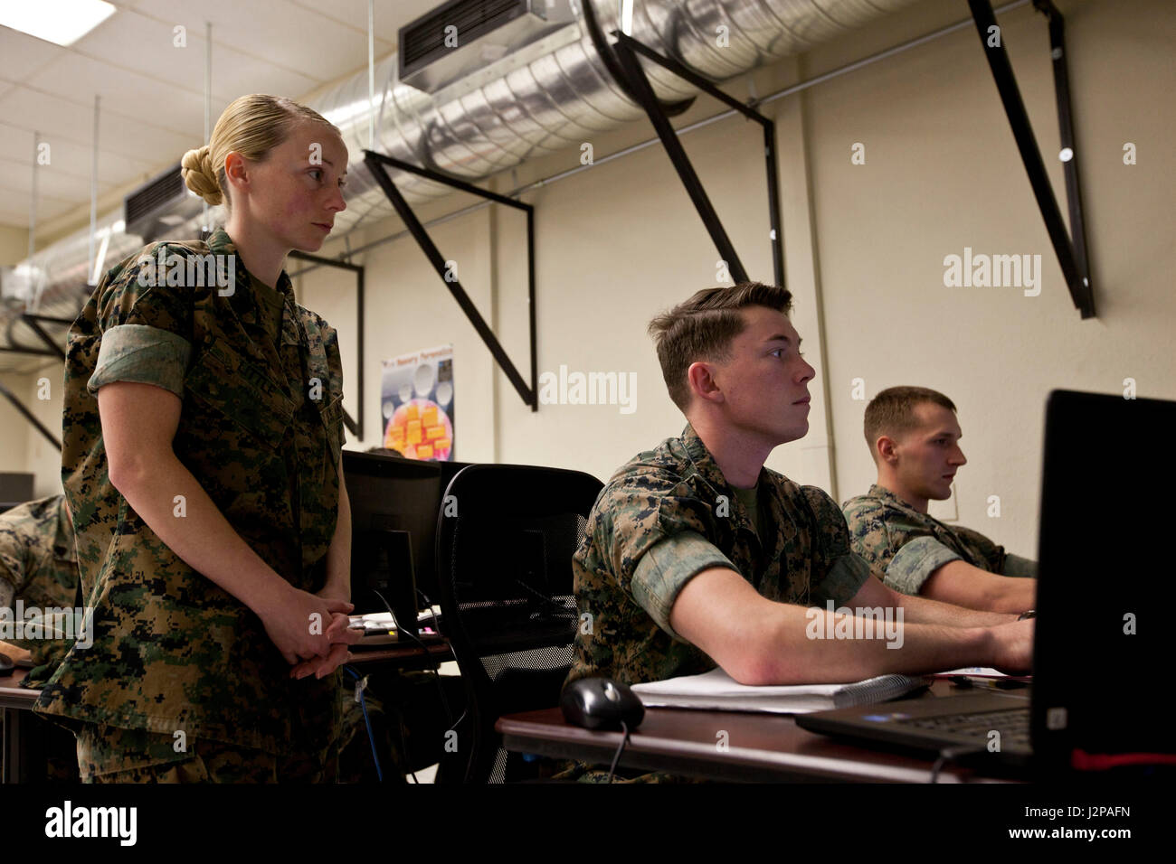 U.S. Marine Corps Gunnery Sgt. Amanda K. Little, left, an instructor