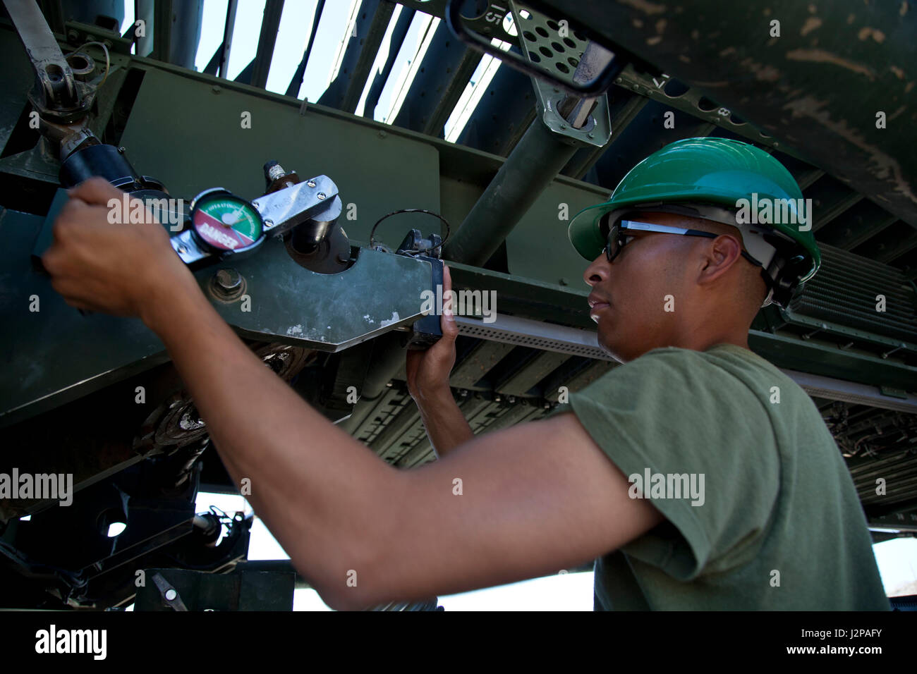 A U.S. Marine assigned to the AN/TPS-59(v)3 Radar Repair Course, Marine Corps Communications-Electronics School, set up a AN/TPS-59(v)3 long range air ...