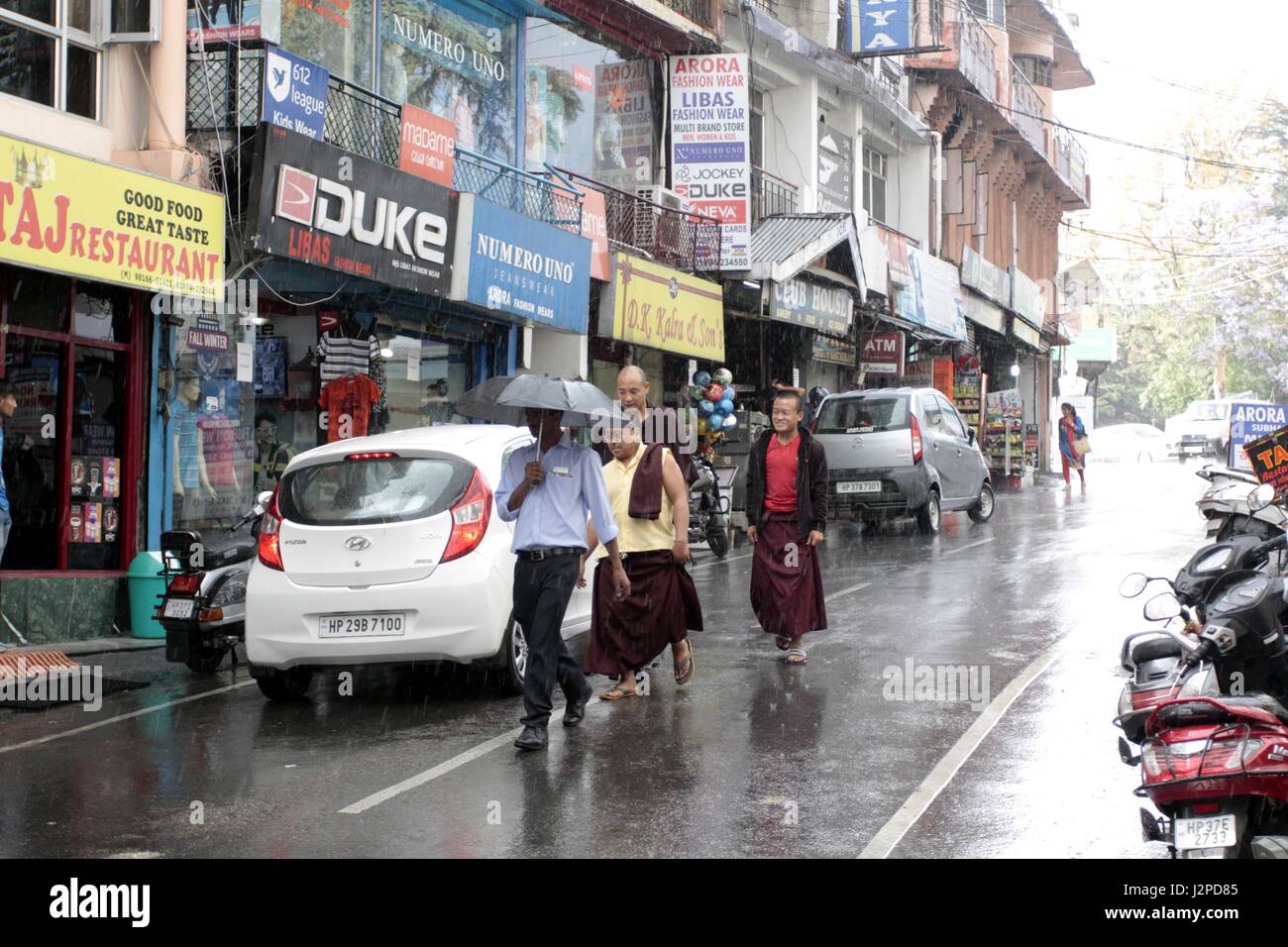 Palampur, India. 30th Apr, 2017. Peoples walking away to home as rain hit in town, Palampur on Sunday. Region get fresh shower as brings the cold waves again, which put people in position to wear again woolens. Credit: Shailesh Bhatnagar/Pacific Press/Alamy Live News Stock Photo