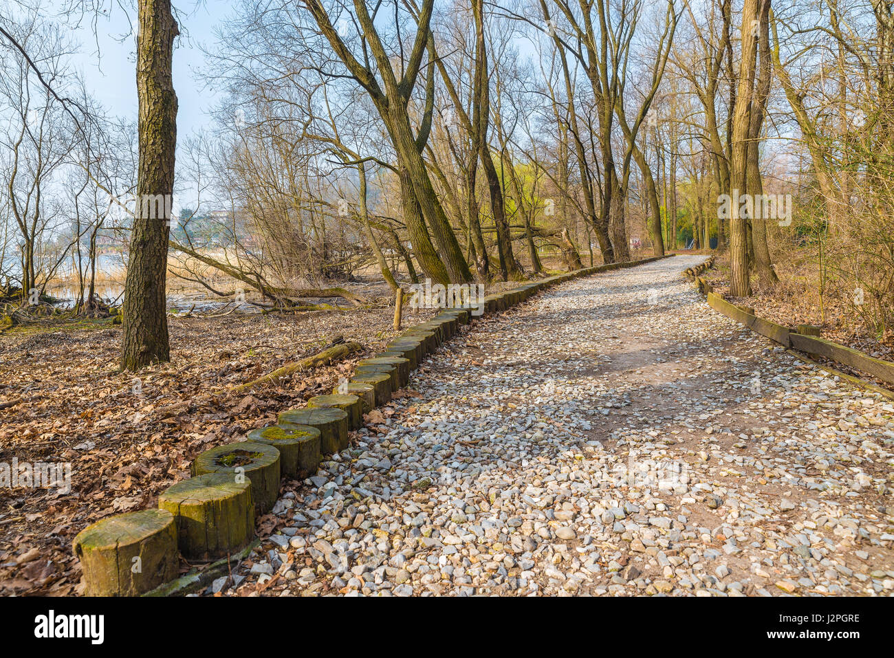 Natural engineering - soil bioengineering.  Example of protection of a dirt road from high water and from water erosion, with natural material Stock Photo