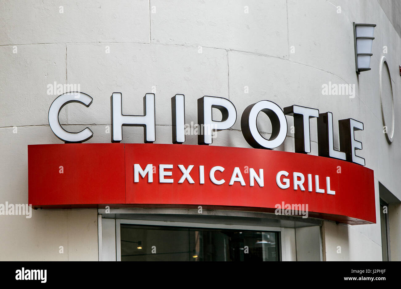 The sign over an entrance to a Chipotle Mexican Grill restaurant in Manhattan. Stock Photo