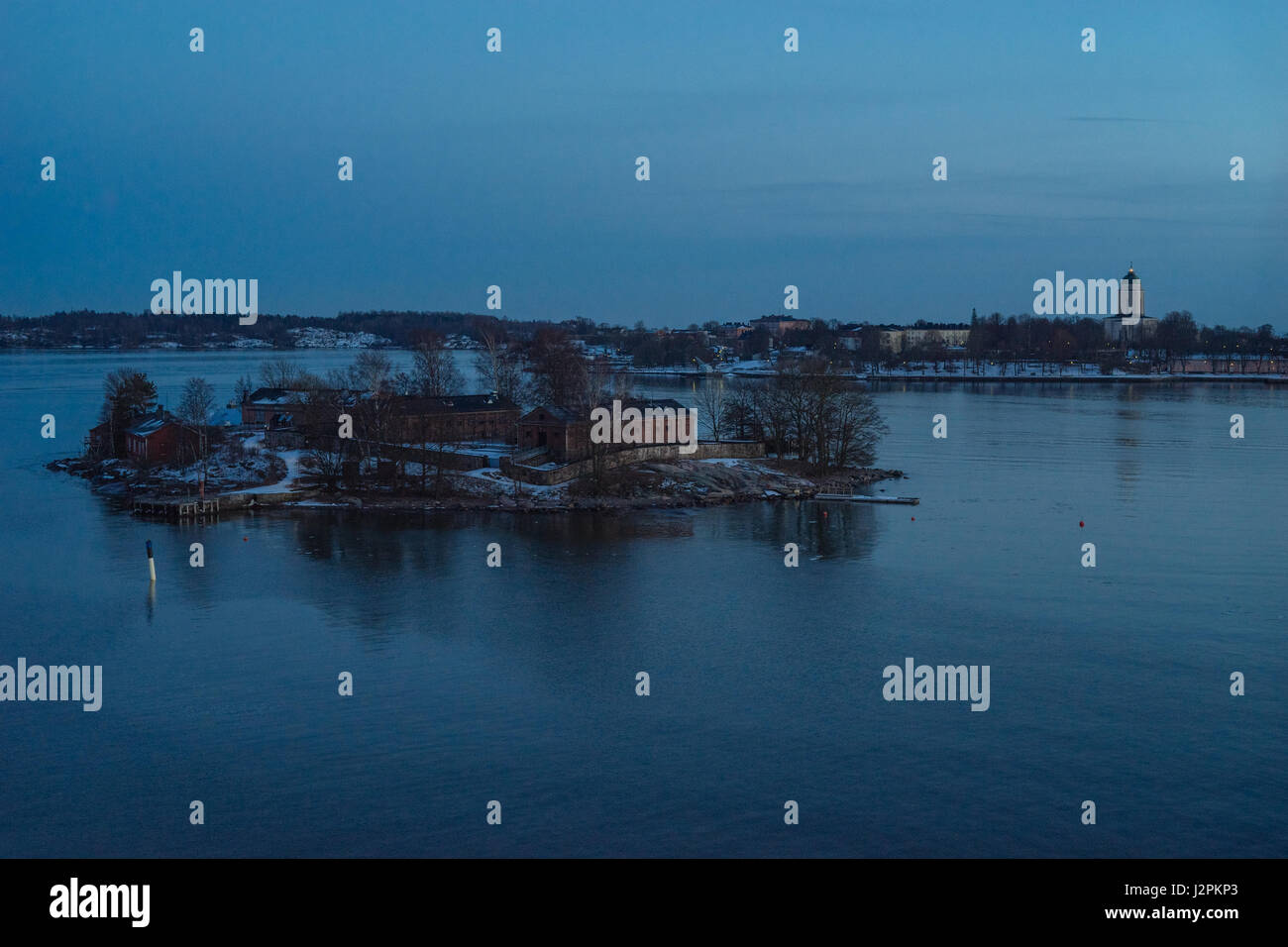 Small island near Helsinki and fortress Suomenlinna on background, Finland Stock Photo
