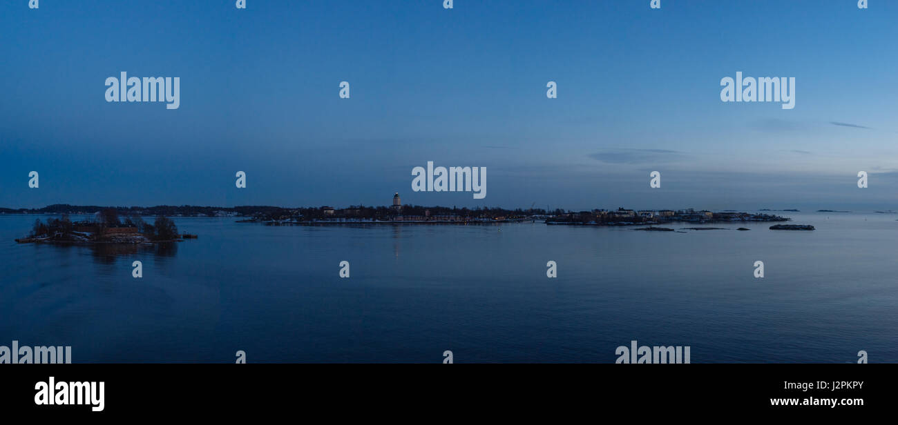 Inhabited sea fortress Suomenlinna or Sveaborg built on six islands, Helsinki, Finland. Panorama by winter evening Stock Photo