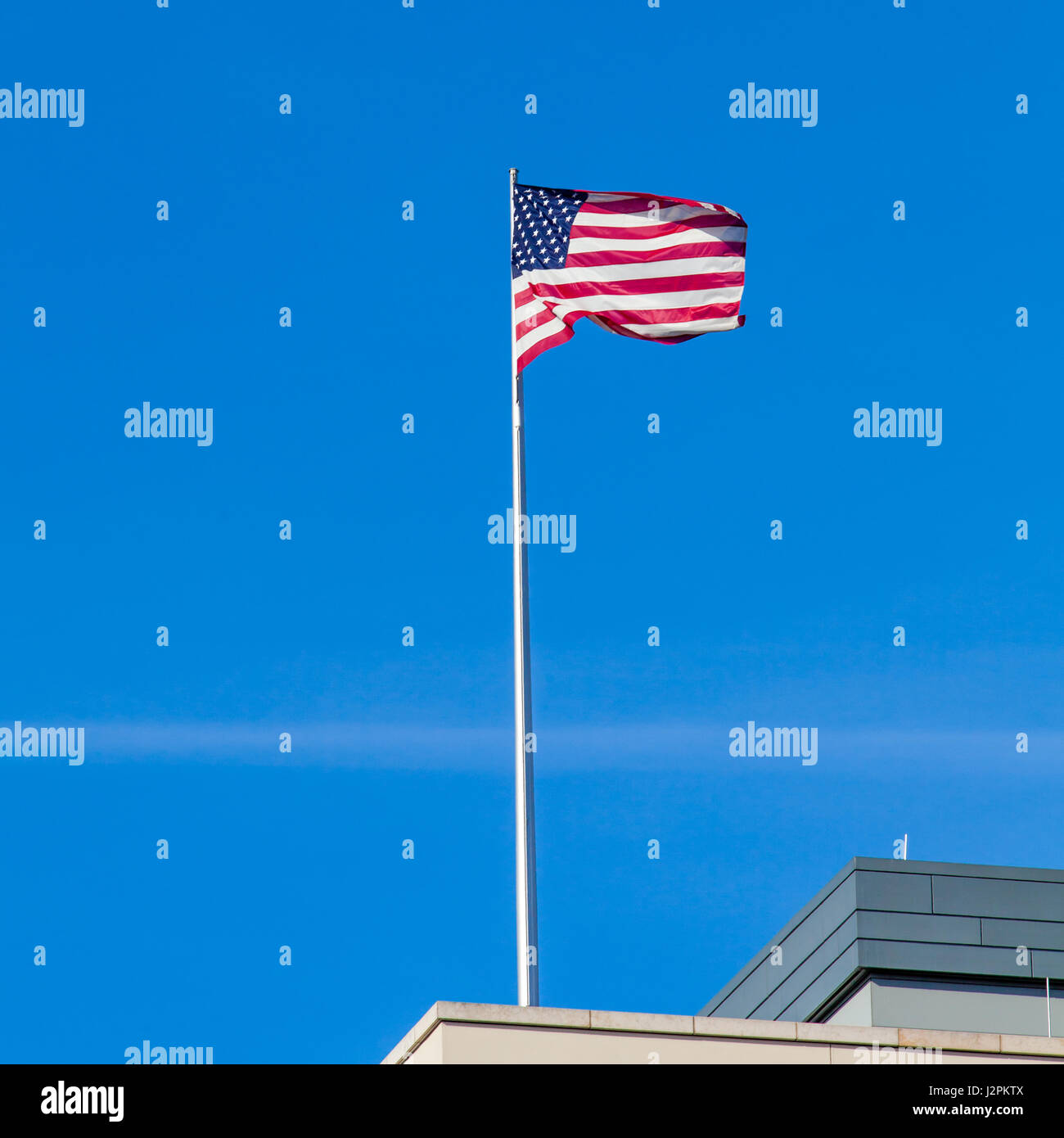 Teekesselchen  Fahne - vom Sturm zerfetzte Deutschlandflagge vor  blaugrauem Himmel - ein lizenzfreies Stock Foto von Photocase