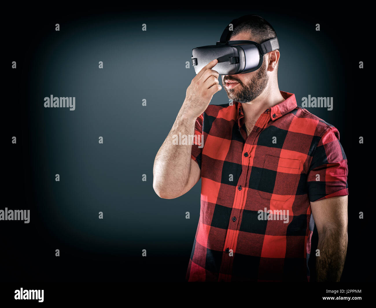 Man wearing virtual reality goggle, cyberspace and people concept Stock Photo