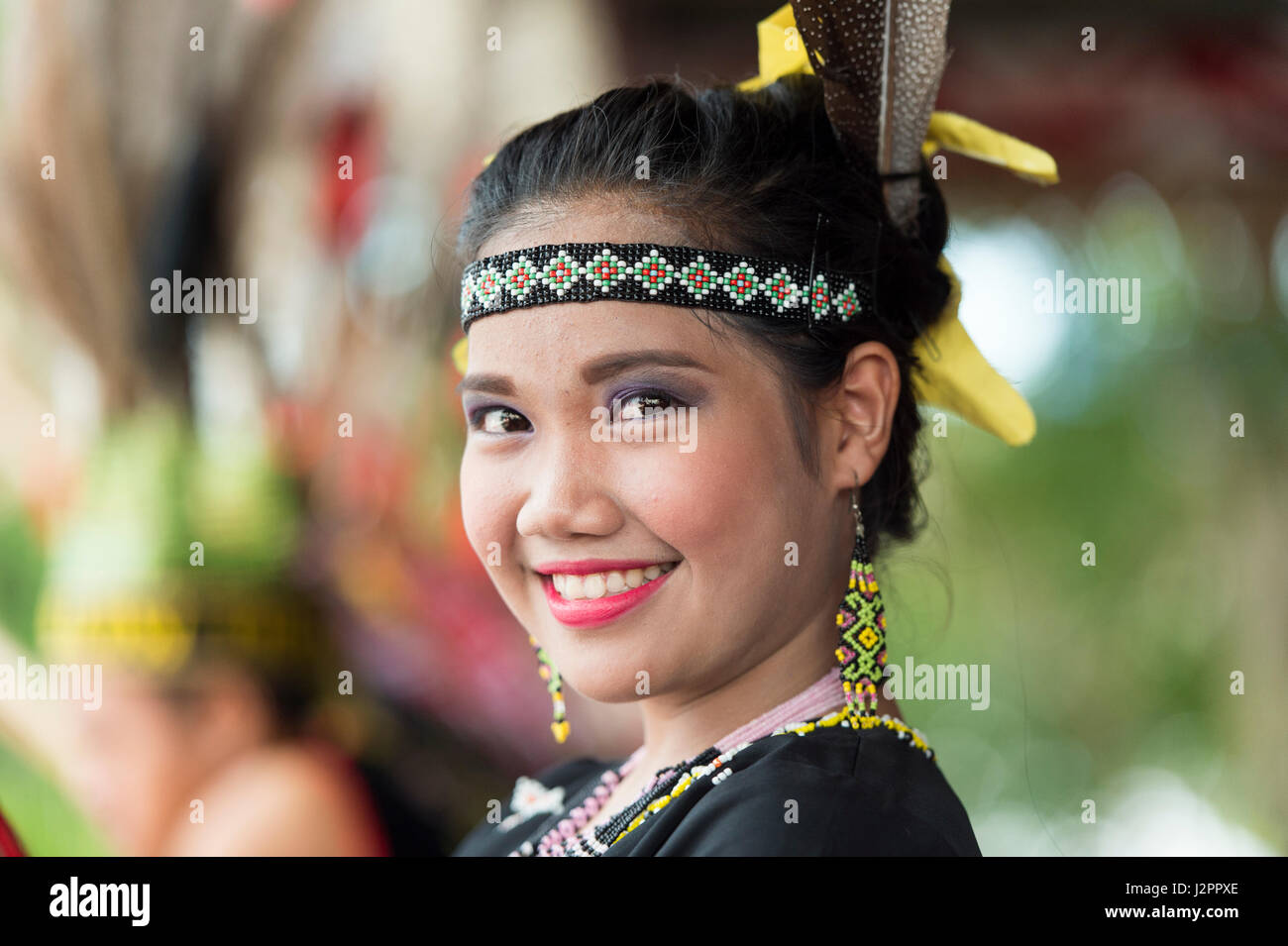 Murut lady in traditional costume decorated with colorful beads during folklore festival in Sipitang Sabah. Stock Photo
