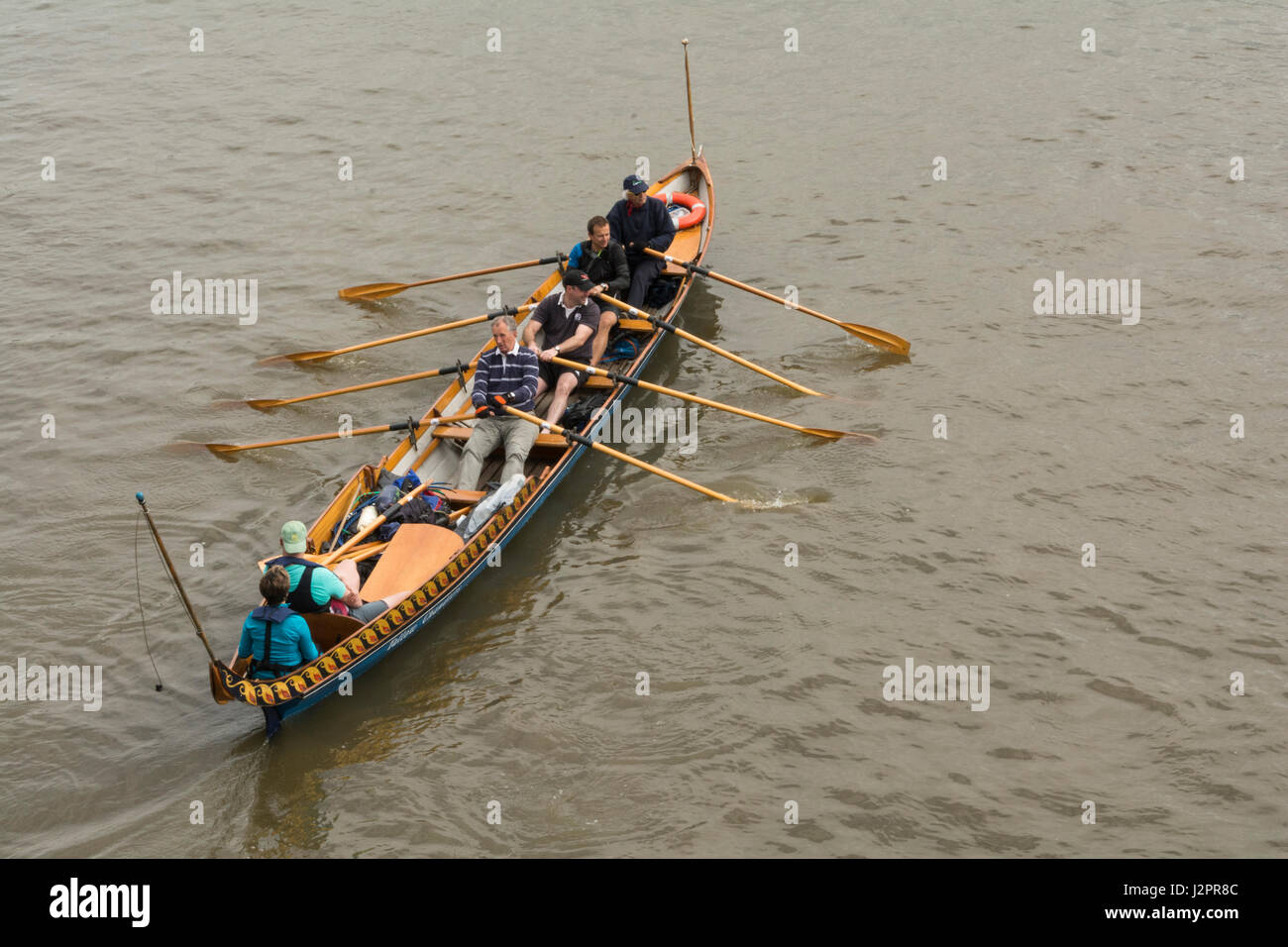 A Cornish Pilot Gig being rowed on the River Thames in London, England