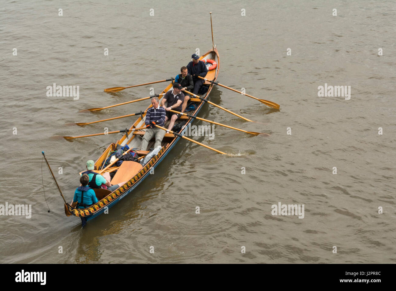 A Cornish Pilot Gig being rowed on the River Thames in London, England, UK Stock Photo