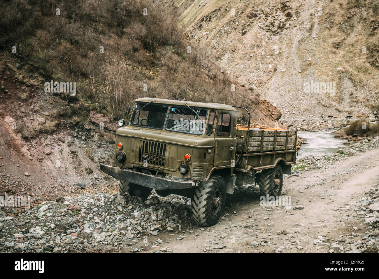 Old Soviet Russian Medium-duty Truck On On Country Road In Summer Mountains Landscape In Truso Gorge, Kazbegi District, Mtskheta-Mtianeti Region, Geor Stock Photo