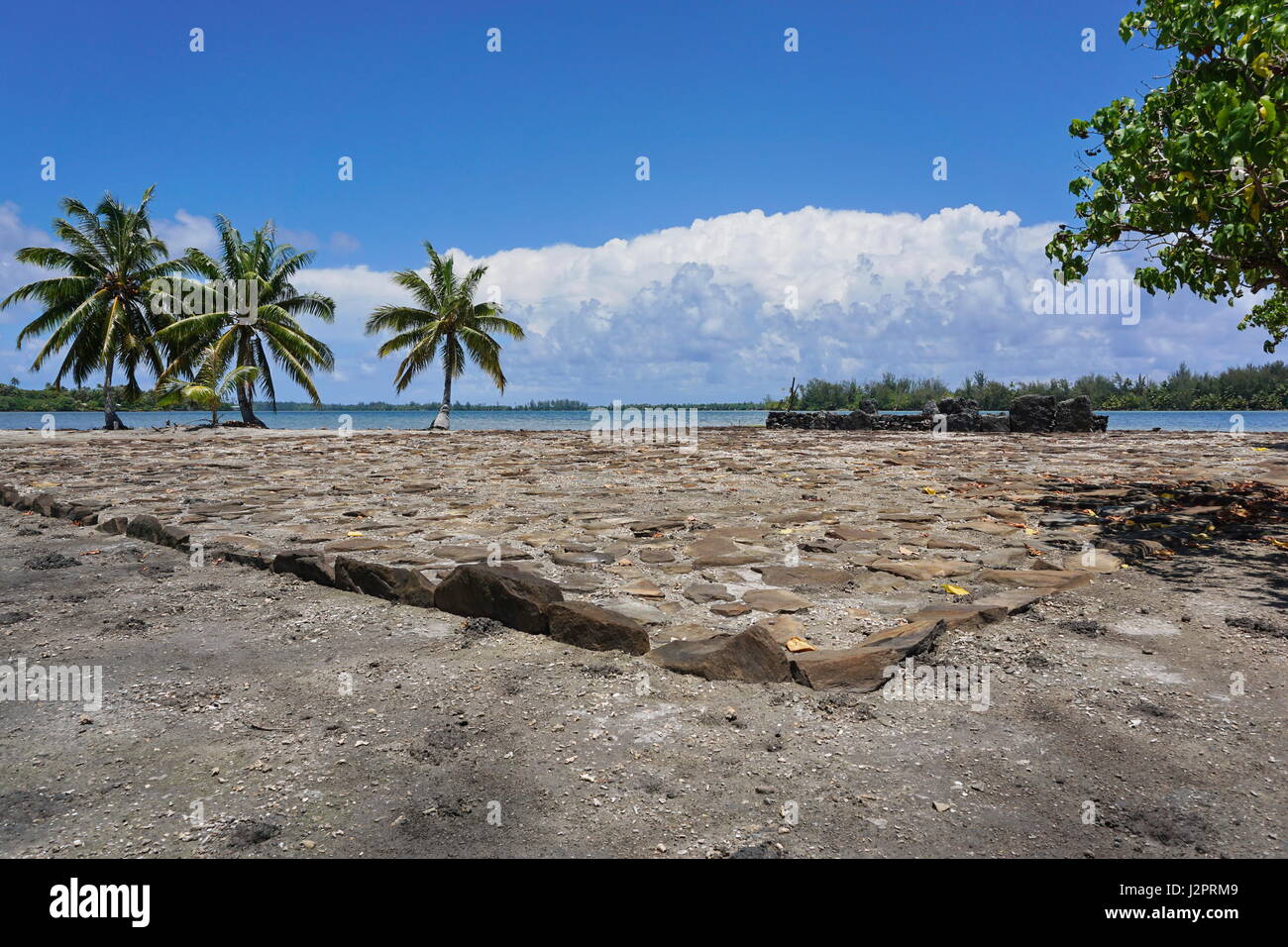 Religious structure called marae made with stones on the shore of the lake Fauna Nui, Maeva, Huahine Nui island, French Polynesia Stock Photo