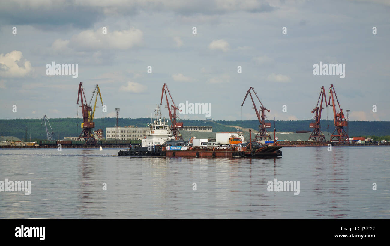 SALEKHARD, RUSSIA - JUNE 24, 2015: The ferry transports passengers and vehicles across the the Ob river in the summer Stock Photo