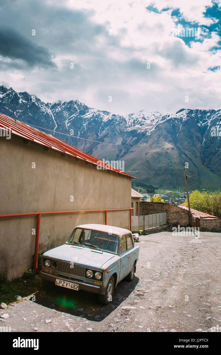 Stepantsminda Gergeti, Georgia - May 23, 2016: Russian Old rusty VAZ-2106 Zhiguli car sedan parking on village street. A hugely popular car, it was in Stock Photo