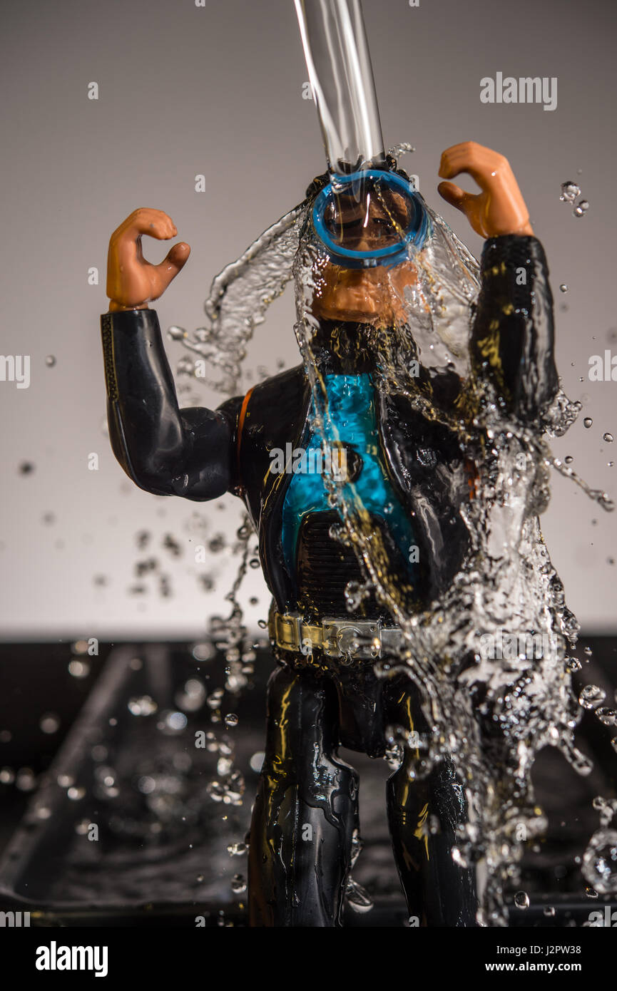 Action Man Figure in wetsuit being soaked with water Stock Photo Alamy