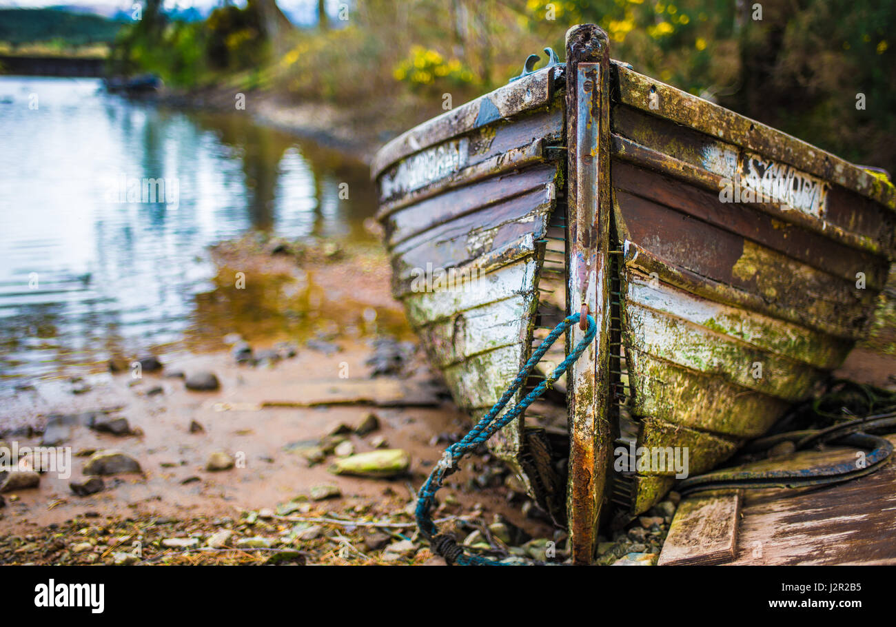 Old fallen apart wooden boat at Gairlochy, Scotland Stock Photo