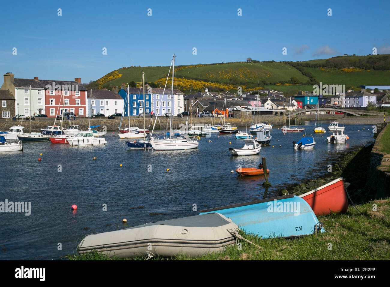 A charming Georgian port town Aberaeron, Ceredigion, West Wales with sailing boats and fishing boats in the harbour. Stock Photo