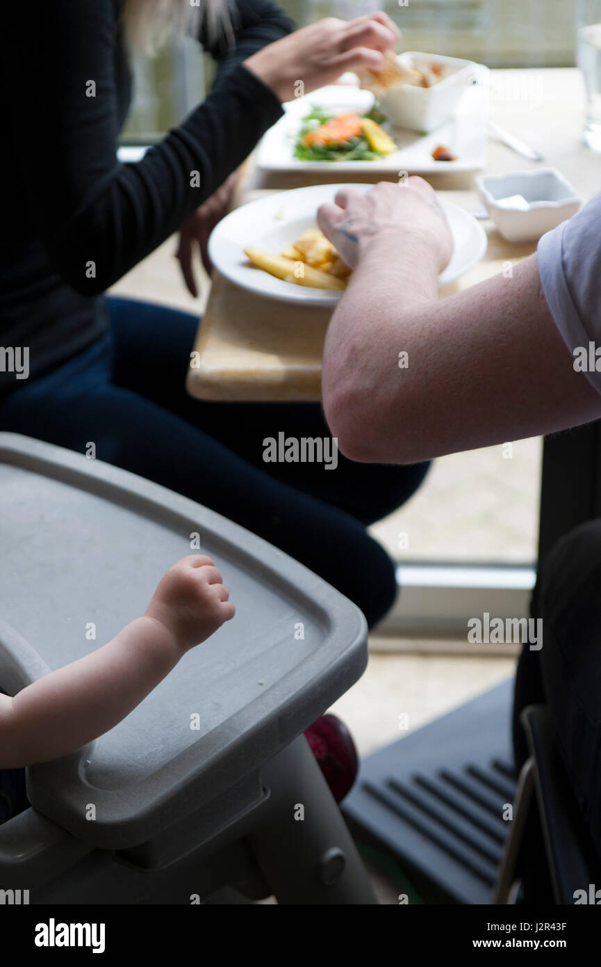 Parents Child Toddler Eating Restaurant Eating together Stock Photo