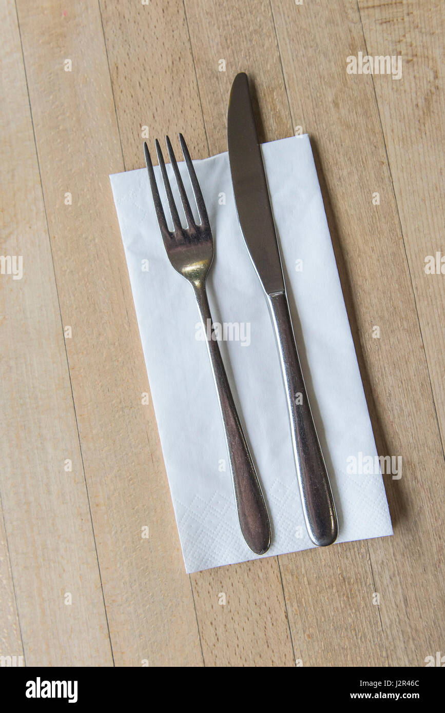 Restaurant interior Table Cutlery Knife Fork Serviette Stock Photo