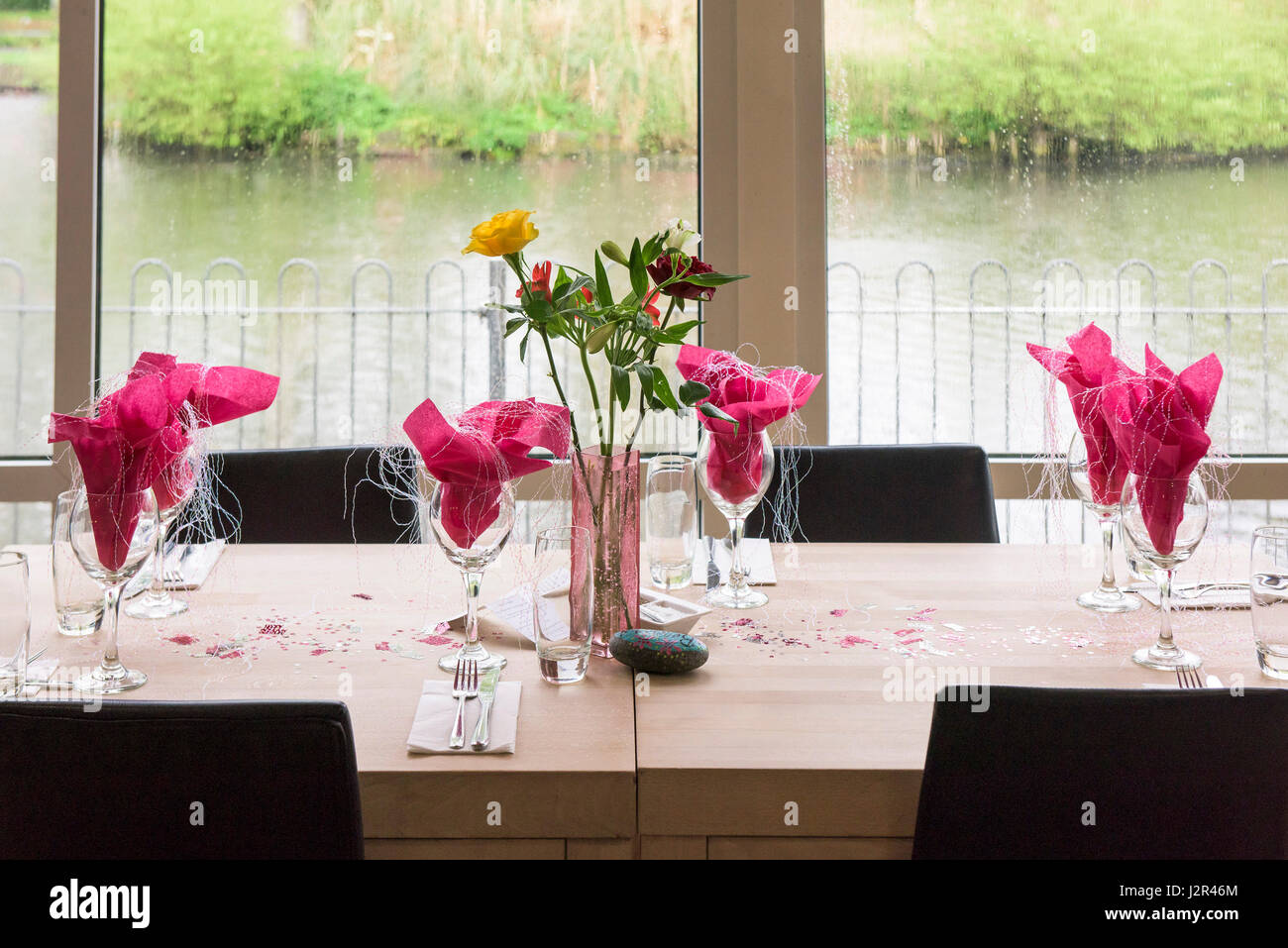 Restaurant interior Table Table decorations Decorated Celebration Celebratory Birthday celebrations Pretty Colourful Colorful Stock Photo