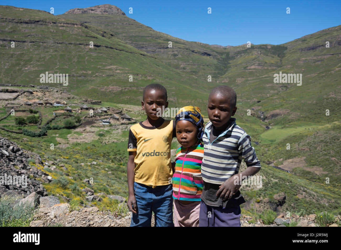 Young children on side of road to Semonkong, Maseru District, Kingdom of Lesotho Stock Photo