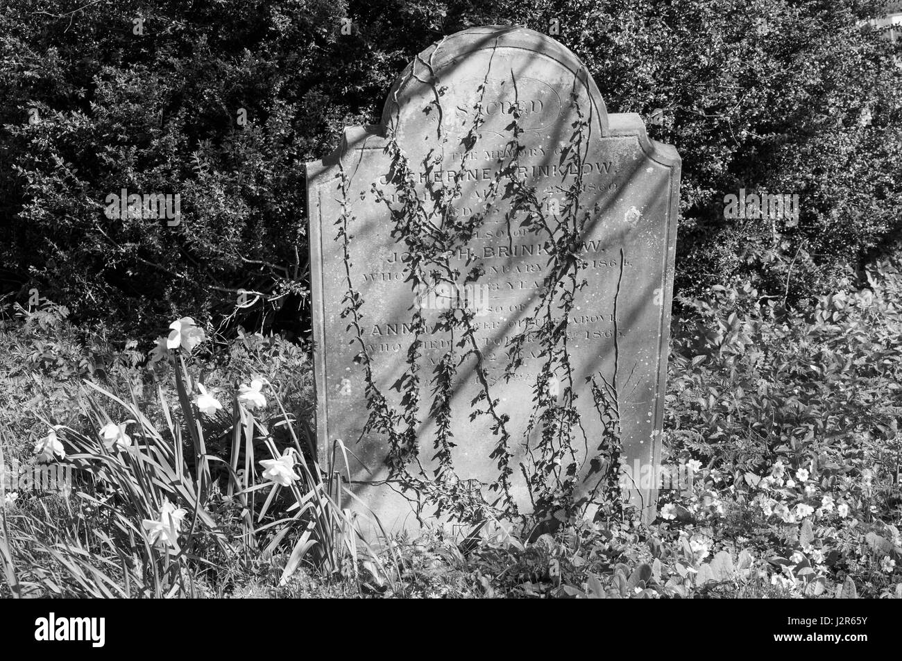 Ancient headstone in churchyard, St John The Baptist Church, Aldbury, Hertfordshire, England, United Kingdom Stock Photo