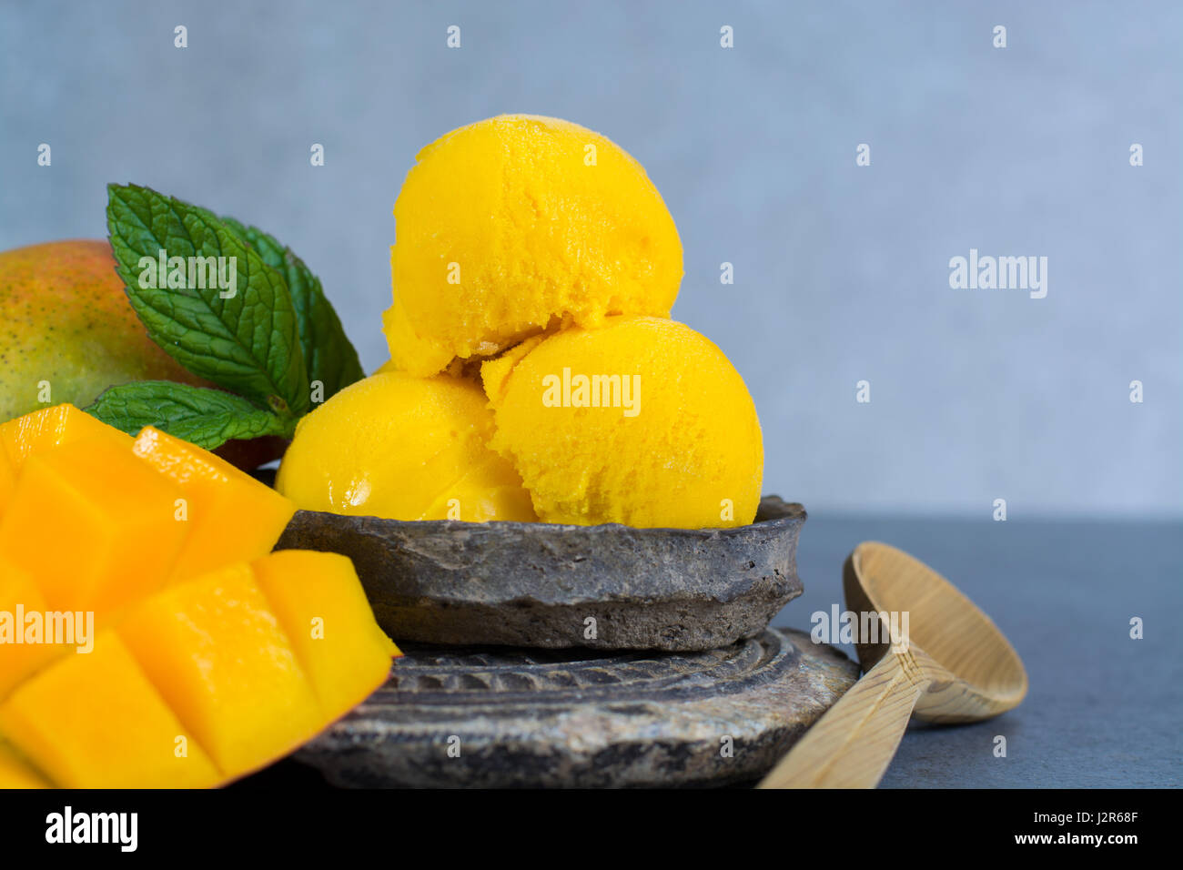 Mango Ice Cream Sorbet With Mint Leaves And Mango Fruit In Black Stone Bowl Stock Photo Alamy