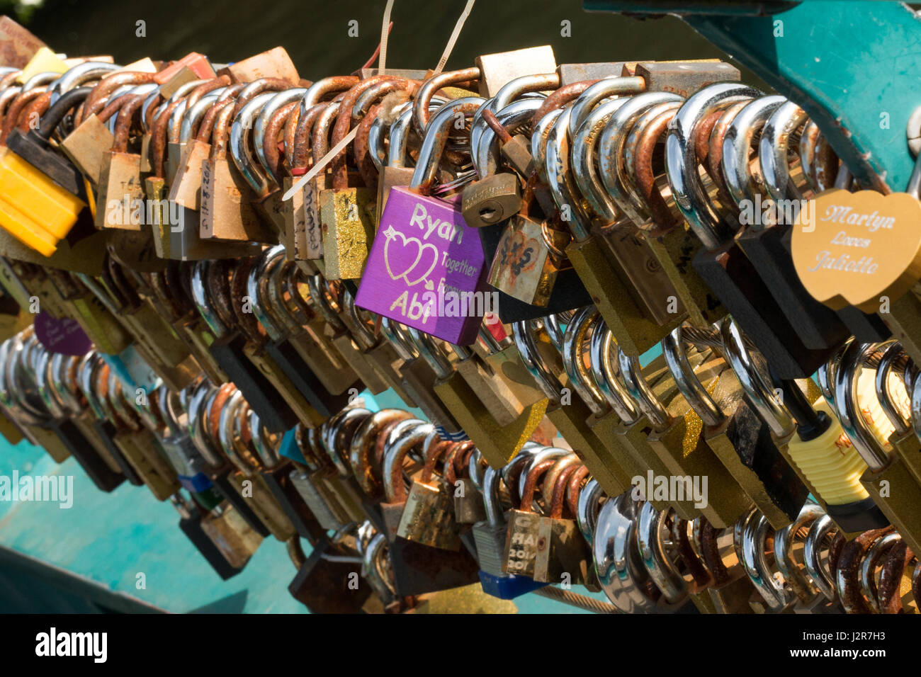 Love locks on the river bridge at Bakewell Derbyshire Stock Photo