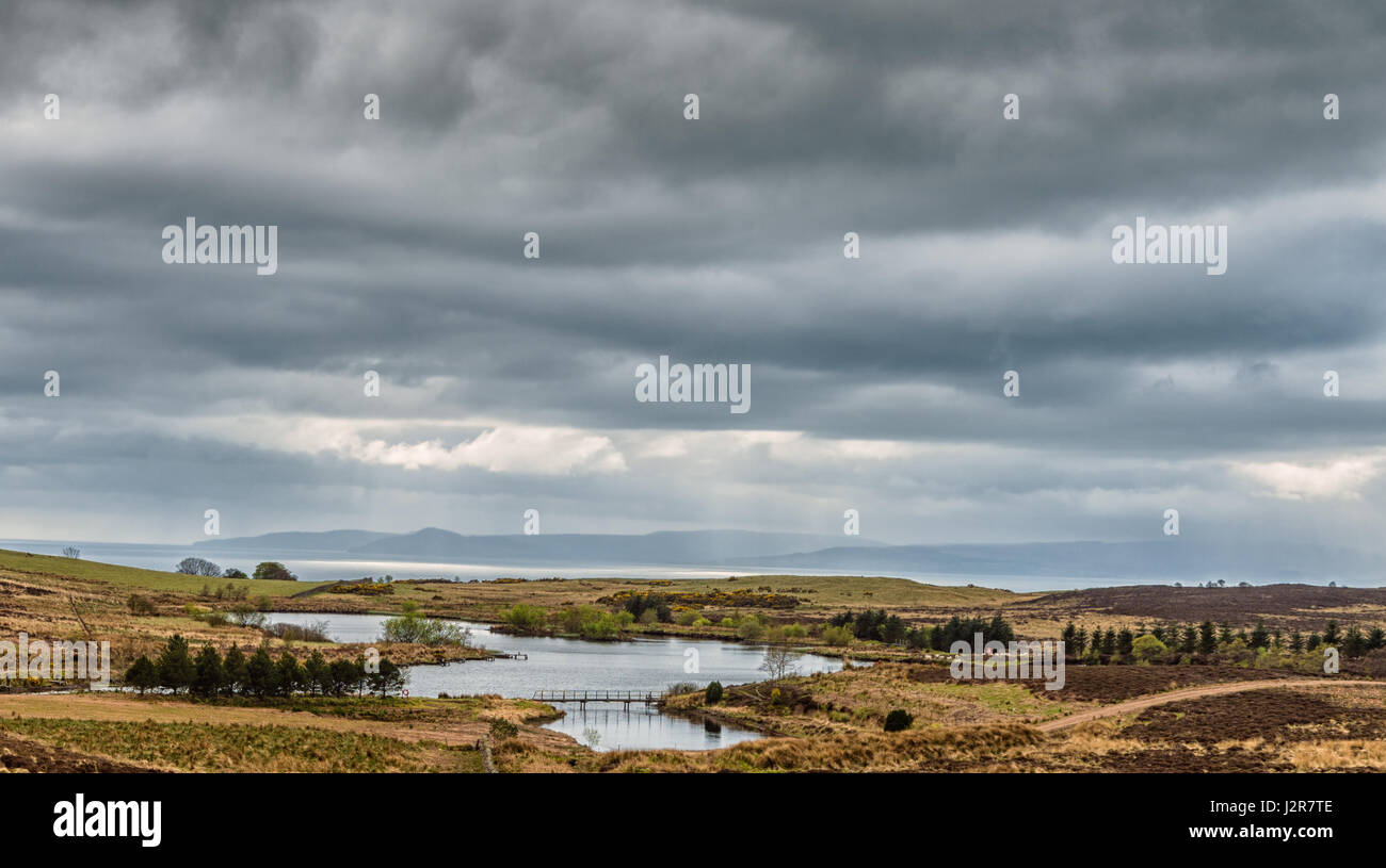 Small Inland reservoir at Fairlie in North Ayrshire. Arran can be seen