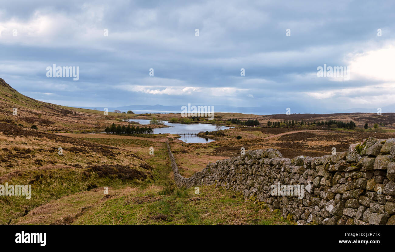 Small Inland reservoir at Fairlie in North Ayrshire. Arran can be seen in the misty distance