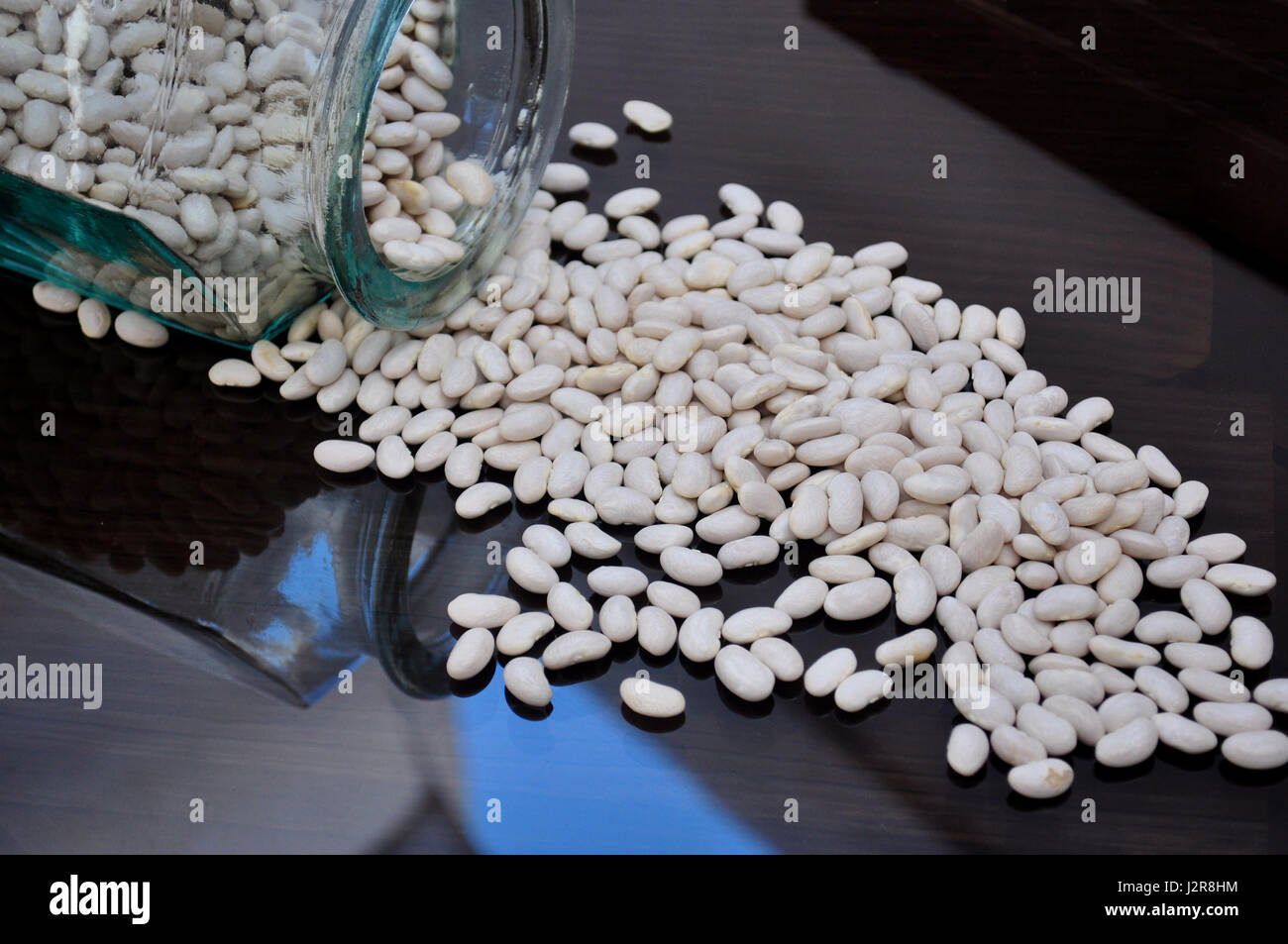 glass jar with beans on dark background Stock Photo - Alamy