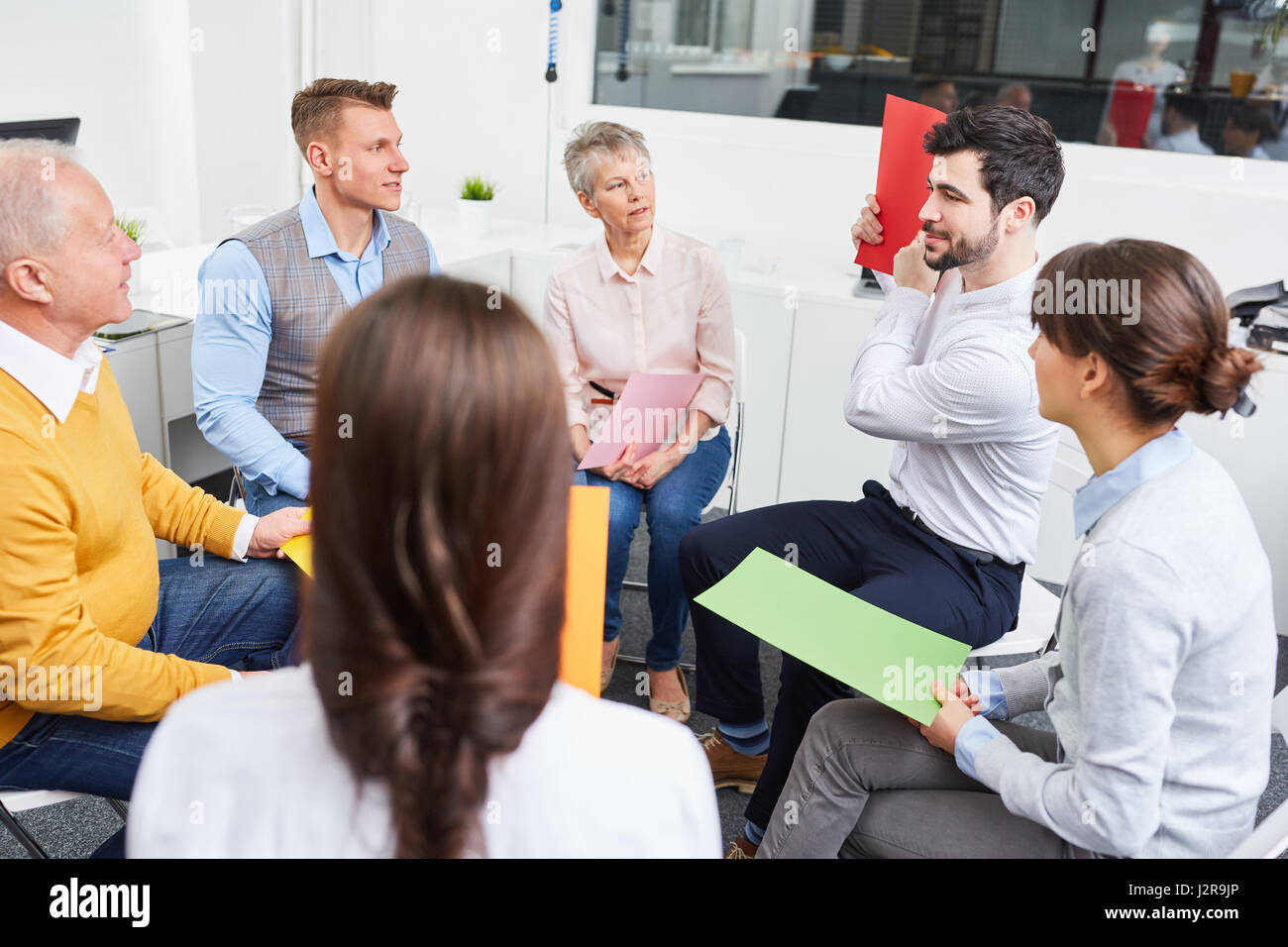 Business people make exercise for teambuilding in office Stock Photo