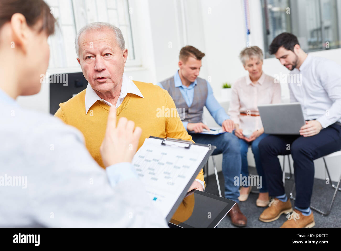 Business consulting advice concept with senior team member Stock Photo