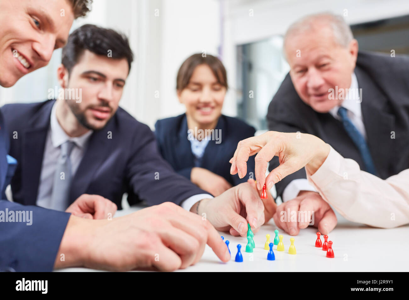 Business team play board game in team building workshop Stock Photo