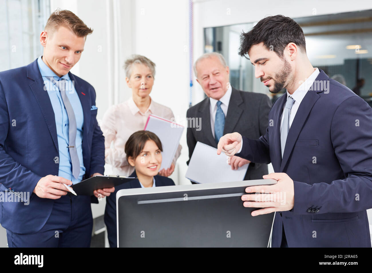 Business team in computer seminar with expert training coach Stock Photo