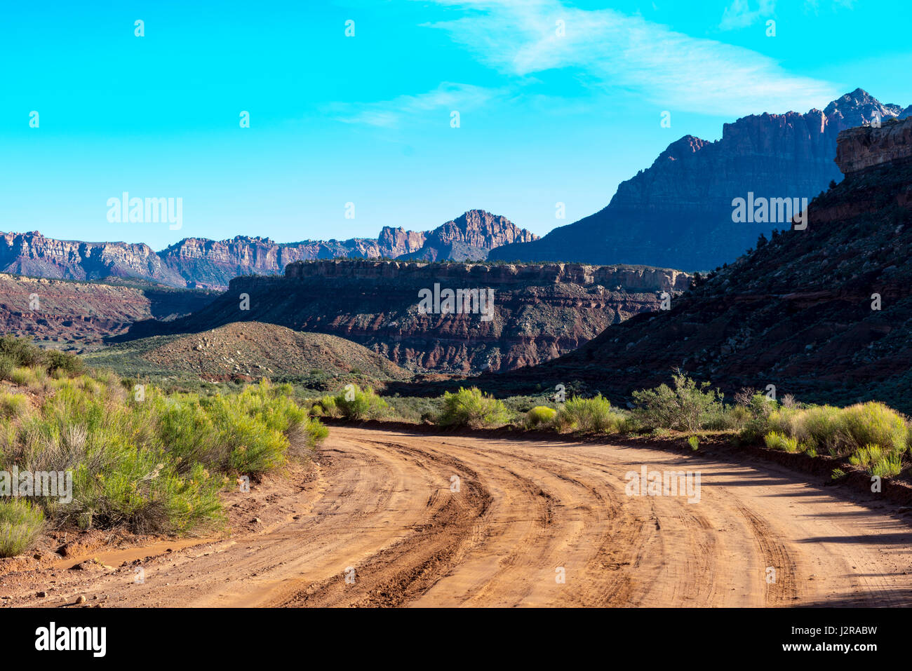Gravel road through the desert of southern Utah Stock Photo Alamy