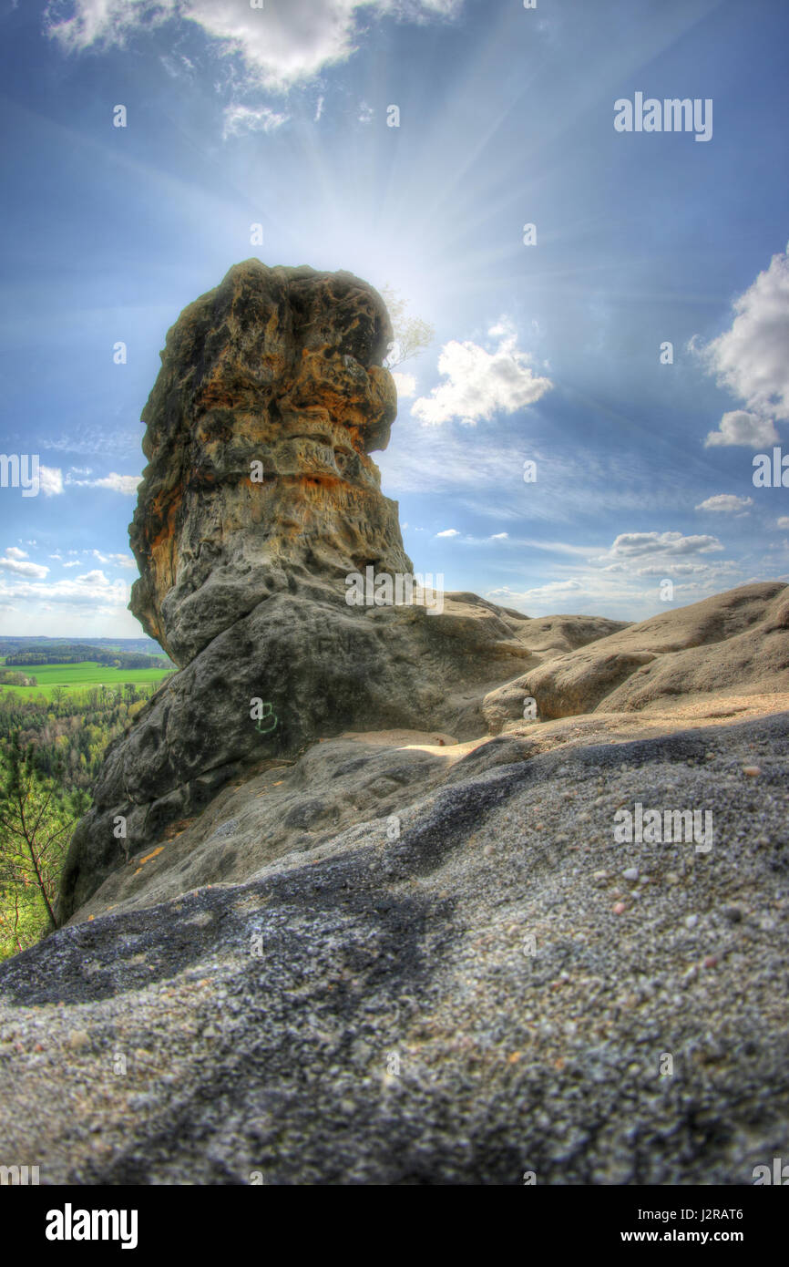 Capska cudgel - rock formation on a rocky promontory is a massive rock cudgel from iron sandstone that rises at the edge of a steep cliff Stock Photo