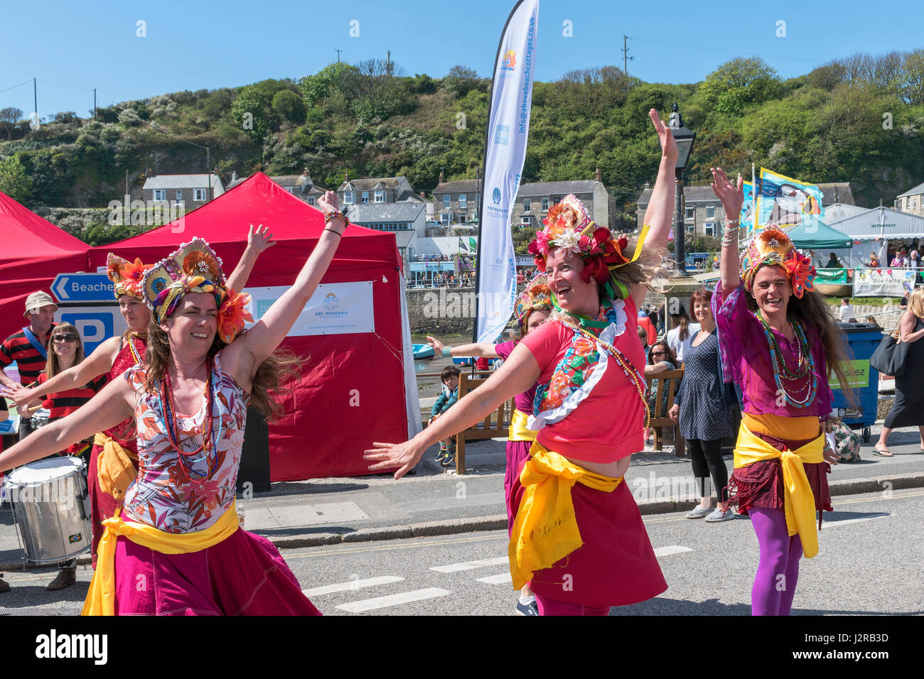 Young women dance group at the Food and Music festival in Porthleven, Cornwall, England, UK Stock Photo