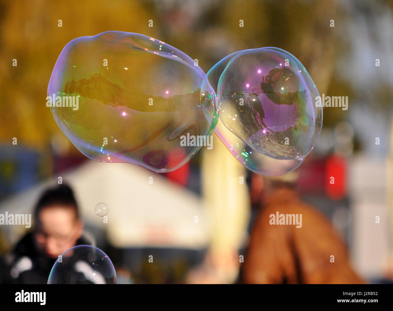 Playing with soap bubbles on the street of Gdynia, Poland, spring time Stock Photo