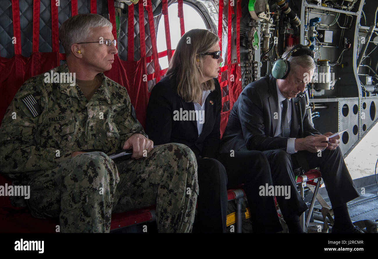 Secretary of Defense Jim Mattis travels via a CH-47 Chinook helicopter to Headquarters Resolute Support in Kabul, Afghanistan, April 24, 2017. To his left are U.S. Navy Rear Adm. Craig Faller, the secretary's senior military assistant, and Sally Donnelly, the secretary's senior advisor. (DOD photo by U.S. Air Force Tech. Sgt. Brigitte N. Brantley) Stock Photo