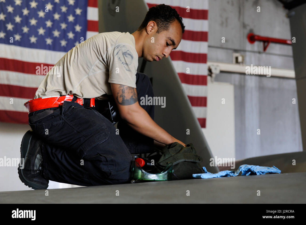 U.S. Air Force Senior Airman Devon Moore, 67th Aircraft Maintenance Unit crew chief, packs up maintenance gear April 24, 2017, at Kadena Air Base, Japan. Proper storage and transportation of tools is important for safety and security of the maintainers. (U.S. Air Force photo by Senior Airman Lynette M. Rolen) Stock Photo