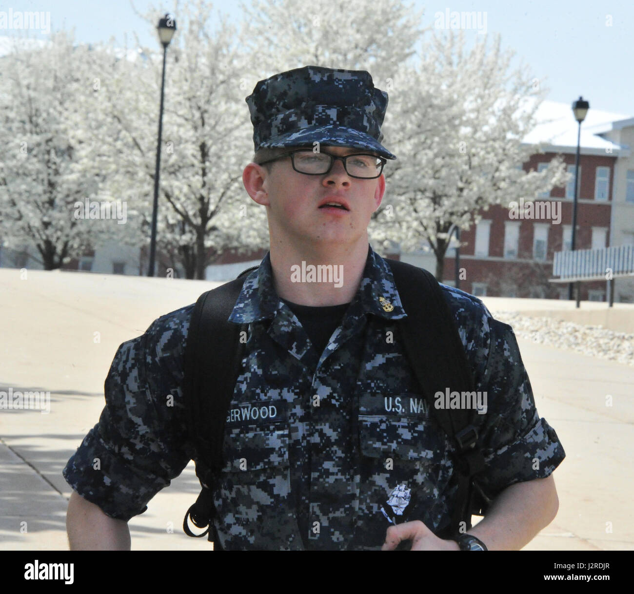 170424-N-SL853-083 GREAT LAKES, Il. (April. 24, 2017) A recruit double-times on base April 24, at Recruit Training Command. Recruits in individual traffic, depending, on weather and medical status, double time to their areas of training and appointments. About 30,000-40,000 recruits graduate annually from the Navy's only boot camp. (U.S. Navy photo by Chief Petty Officer Seth Schaeffer/Released) Stock Photo