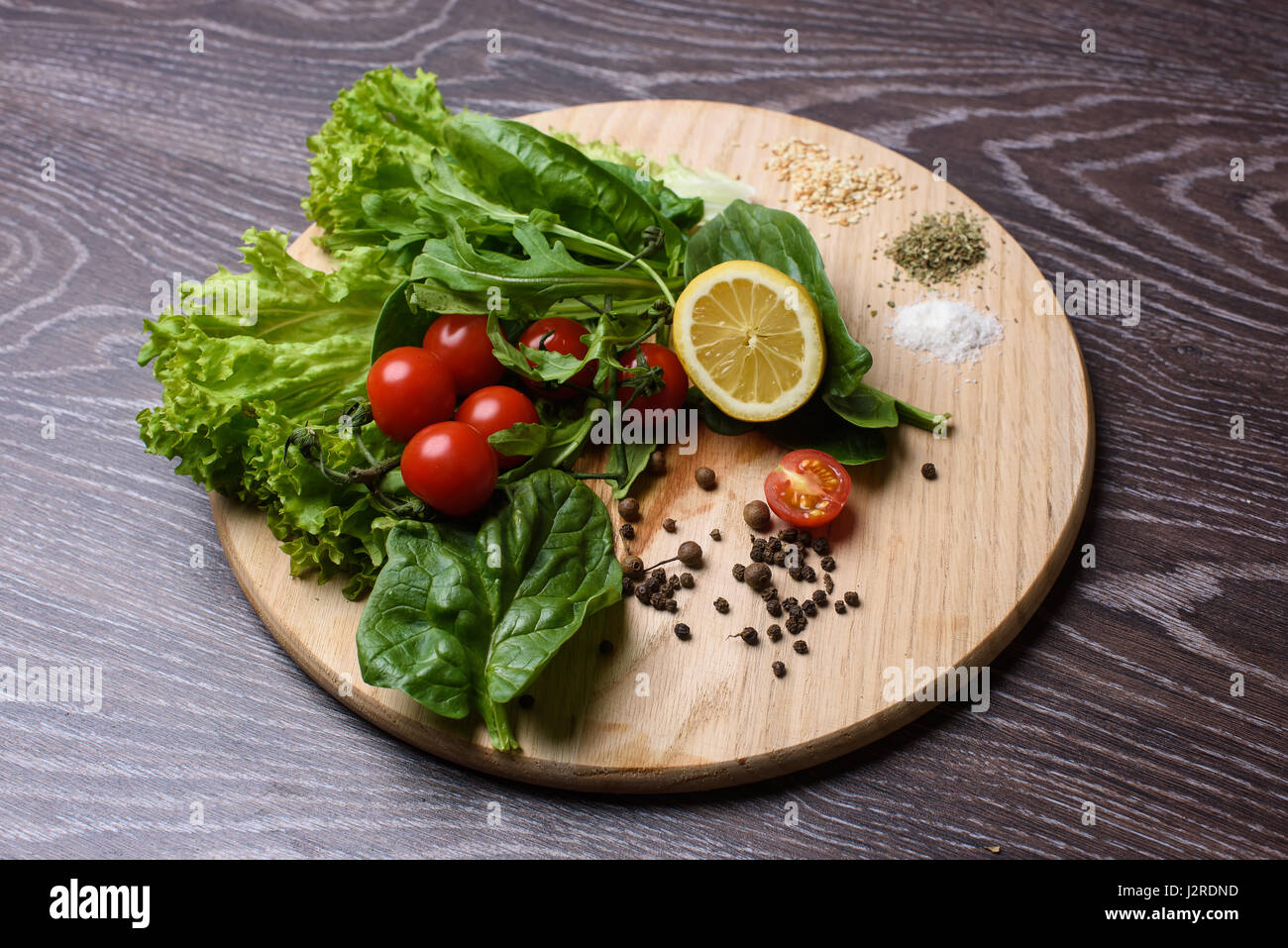 Ingredients for cooking on a wooden chopping board. Stock Photo