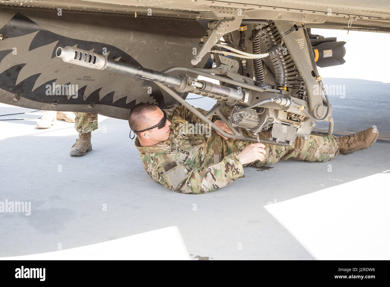 A U.S. Army AH64E Apache helicopter ground crew member assigned to Task Force Tigershark, 16th